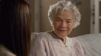 Movie still from “God's Not Dead” (2014), directed by Harold Cronk – An older woman sitting next to a younger woman; Close Up shot, Over the shoulder angle