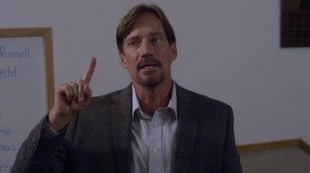 Movie still from “God's Not Dead” (2014), directed by Harold Cronk – A person wearing a suit and tie; Close Up shot, Low angle