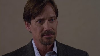 Movie still from “God's Not Dead” (2014), directed by Harold Cronk – A person wearing a suit and tie; Close Up shot, Over the shoulder angle