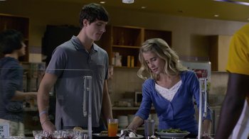 Movie still from “God's Not Dead” (2014), directed by Harold Cronk – A man and a woman sitting at a dinner table; Medium shot, Low angle