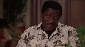 Movie still from “God's Not Dead” (2014), directed by Harold Cronk – A person wearing a button up shirt; Close Up shot, High angle