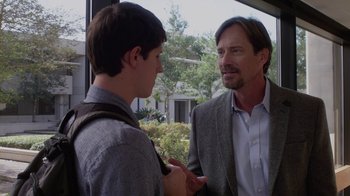 Movie still from “God's Not Dead” (2014), directed by Harold Cronk – A man in a suit talking to a young man; Medium shot, Over the shoulder angle