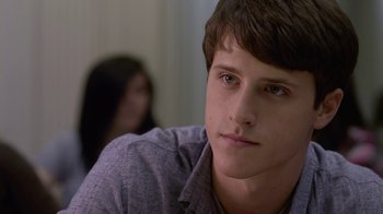 Movie still from “God's Not Dead” (2014), directed by Harold Cronk – A young man sitting in front of a woman in a room; Close Up shot, Over the shoulder angle
