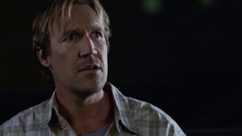 Movie still from “God's Not Dead” (2014), directed by Harold Cronk – A person wearing a plaid shirt; Close Up shot, Over the shoulder angle