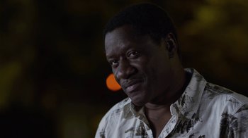 Movie still from “God's Not Dead” (2014), directed by Harold Cronk – A person wearing a white shirt; Close Up shot, Low angle