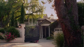 Movie still from “God's Not Dead” (2014), directed by Harold Cronk – A house with a driveway and a fence; Extreme Wide shot, Low angle
