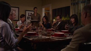 Movie still from “God's Not Dead” (2014), directed by Harold Cronk – A group of people sitting around a dinner table; Medium shot, High angle