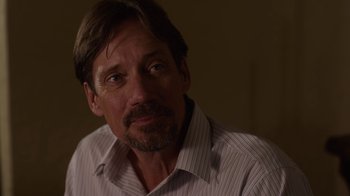 Movie still from “God's Not Dead” (2014), directed by Harold Cronk – A person wearing a striped shirt; Close Up shot, Over the shoulder angle