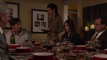 Movie still from “God's Not Dead” (2014), directed by Harold Cronk – Two women standing in front of a table filled with wine glasses; Medium shot, Over the shoulder angle
