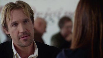 Movie still from “God's Not Dead” (2014), directed by Harold Cronk – A person wearing a suit and tie; Close Up shot, Over the shoulder angle