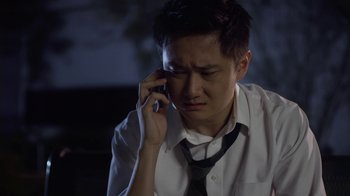 Movie still from “God's Not Dead” (2014), directed by Harold Cronk – A man in a white shirt and a black tie talking on a cell phone; Close Up shot, High angle