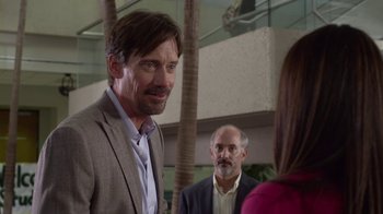 Movie still from “God's Not Dead” (2014), directed by Harold Cronk – Two men and a woman are standing in front of a building; Close Up shot, Over the shoulder angle