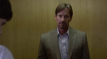 Movie still from “God's Not Dead” (2014), directed by Harold Cronk – A person wearing a suit and tie; Close Up shot, Over the shoulder angle