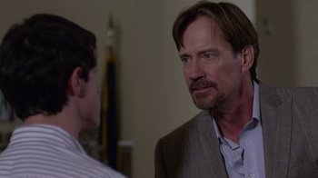 Movie still from “God's Not Dead” (2014), directed by Harold Cronk – A man in a suit and tie talking to another man in a suit and tie; Close Up shot, Over the shoulder angle
