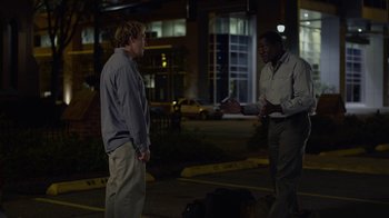 Movie still from “God's Not Dead” (2014), directed by Harold Cronk – Two men standing on the side of the road at night talking; Wide shot, Over the shoulder angle