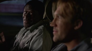 Movie still from “God's Not Dead” (2014), directed by Harold Cronk – Two men sitting in the back seat of a car; Close Up shot, Over the shoulder angle