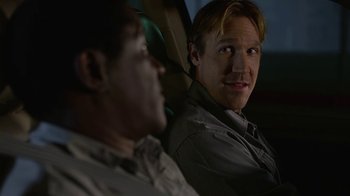 Movie still from “God's Not Dead” (2014), directed by Harold Cronk – A man sitting next to another man in a car; Close Up shot, Over the shoulder angle