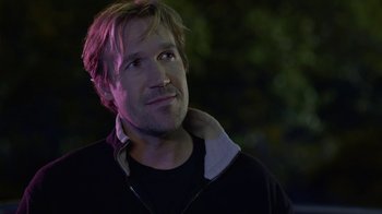 Movie still from “God's Not Dead” (2014), directed by Harold Cronk – A person wearing a black shirt; Close Up shot, Over the shoulder angle