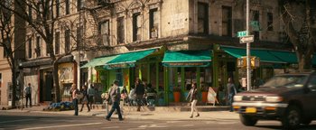 Movie still from “How to Be Single” (2016), directed by Christian Ditter – A group of people walking down a street near a building; Extreme Wide shot, High angle
