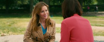 Movie still from “How to Be Single” (2016), directed by Christian Ditter – A woman in a trench coat talking to another woman; Medium shot, Over the shoulder angle