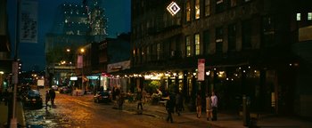 Movie still from “How to Be Single” (2016), directed by Christian Ditter – A group of people walking down a street at night; Extreme Wide shot, High angle