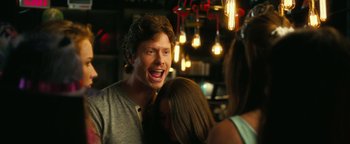 Movie still from “How to Be Single” (2016), directed by Christian Ditter – A man and a woman standing next to each other in a room; Close Up shot, Over the shoulder angle