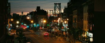 Movie still from “How to Be Single” (2016), directed by Christian Ditter – A city street at night lit up by street lights; Extreme Wide shot, High angle