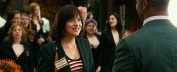 Movie still from “How to Be Single” (2016), directed by Christian Ditter – A group of people standing next to each other in a room; Medium shot, Over the shoulder angle