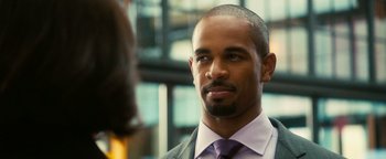 Movie still from “How to Be Single” (2016), directed by Christian Ditter – A person wearing a suit and tie; Close Up shot, Over the shoulder angle