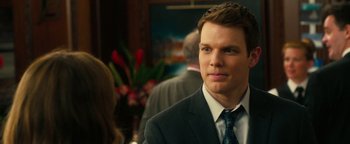 Movie still from “How to Be Single” (2016), directed by Christian Ditter – A man in a suit and tie looking to his left; Close Up shot, Over the shoulder angle