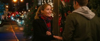 Movie still from “How to Be Single” (2016), directed by Christian Ditter – A woman wearing a red and blue scarf and a black jacket; Medium shot, Over the shoulder angle