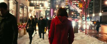 Movie still from “How to Be Single” (2016), directed by Christian Ditter – A woman in a red jacket is walking down the street; Wide shot, Over the shoulder angle