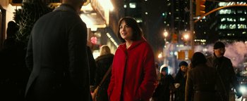 Movie still from “How to Be Single” (2016), directed by Christian Ditter – A woman in a red coat standing on a sidewalk; Medium shot, Over the shoulder angle