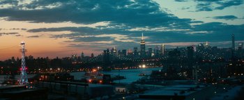Movie still from “How to Be Single” (2016), directed by Christian Ditter – A view of a city skyline at night with lights; Extreme Wide shot, High angle