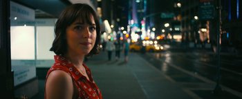Movie still from “How to Be Single” (2016), directed by Christian Ditter – A woman standing on the side of a road at night; Close Up shot, Over the shoulder angle