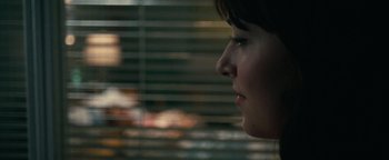 A person looking out a window