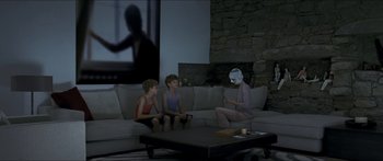 Movie still from “Goodnight Mommy” (2014), directed by Severin Fiala – Two children sitting on a couch and a person sitting on a couch; Wide shot, Over the shoulder angle