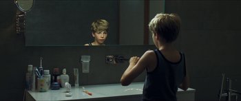 Movie still from “Goodnight Mommy” (2014), directed by Severin Fiala – A boy brushing his teeth in front of a bathroom mirror; Close Up shot, Over the shoulder angle