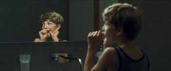 Movie still from “Goodnight Mommy” (2014), directed by Severin Fiala – A young boy brushing his teeth in the mirror; Close Up shot, Over the shoulder angle