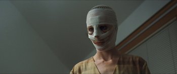Movie still from “Goodnight Mommy” (2014), directed by Severin Fiala – A woman with bandages all over her face; Close Up shot, Low angle