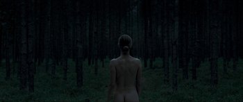 Movie still from “Goodnight Mommy” (2014), directed by Severin Fiala – A woman standing in the middle of a forest; Wide shot, Low angle