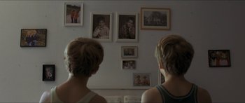 Movie still from “Goodnight Mommy” (2014), directed by Severin Fiala – A couple of people that are sitting in a room; Close Up shot, Over the shoulder angle