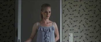 Movie still from “Goodnight Mommy” (2014), directed by Severin Fiala – A woman standing in front of a bathroom mirror; Close Up shot, Over the shoulder angle