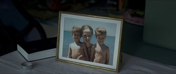 Movie still from “Goodnight Mommy” (2014), directed by Severin Fiala – A picture of three kids in a picture frame on a table; Extreme Close Up shot, High angle
