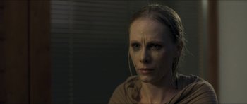 Movie still from “Goodnight Mommy” (2014), directed by Severin Fiala – A person wearing a brown shirt; Close Up shot, Over the shoulder angle