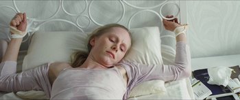 Movie still from “Goodnight Mommy” (2014), directed by Severin Fiala – A young girl sleeping in a bed with a pillow; Close Up shot, Overhead angle