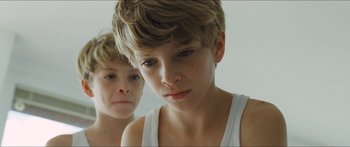 Movie still from “Goodnight Mommy” (2014), directed by Severin Fiala – Two young boys looking at each other in the mirror; Close Up shot, High angle