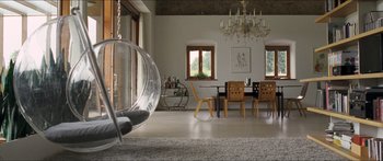 Movie still from “Goodnight Mommy” (2014), directed by Severin Fiala – A living room with a table and chairs in it; Wide shot, Low angle