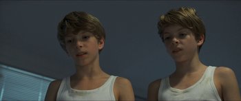 Movie still from “Goodnight Mommy” (2014), directed by Severin Fiala – Two young boys are posing for a picture; Close Up shot, High angle