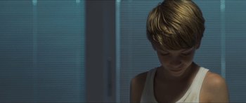 Movie still from “Goodnight Mommy” (2014), directed by Severin Fiala – A young boy sitting in front of a window in the dark; Close Up shot, Over the shoulder angle
